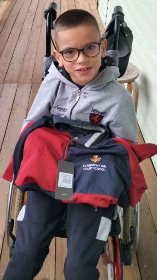 Little boy receiving clothes